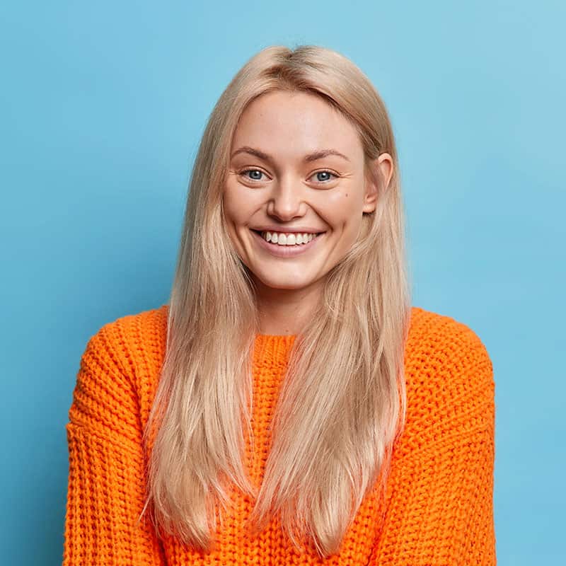 portrait of cheerful blonde young woman smiles gen CZDTYQ4